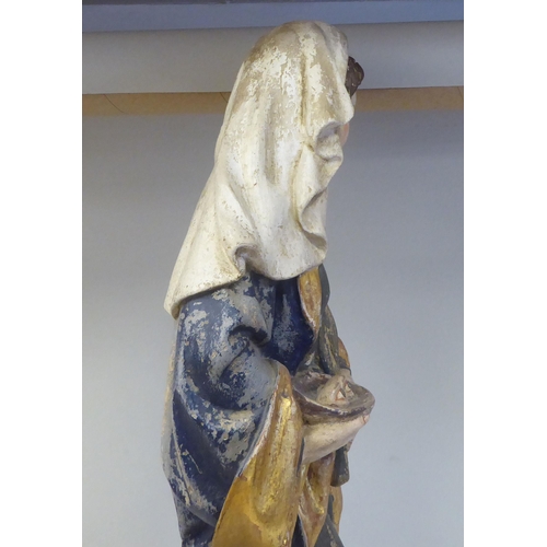 43 - A 19thC carved and painted wooden figure 'St Lucy Patron Saint of Sight and Sufferers of Eye Disease... 