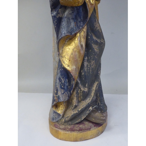 43 - A 19thC carved and painted wooden figure 'St Lucy Patron Saint of Sight and Sufferers of Eye Disease... 