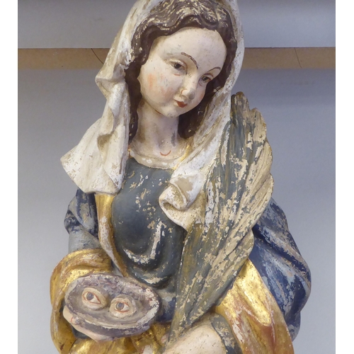 43 - A 19thC carved and painted wooden figure 'St Lucy Patron Saint of Sight and Sufferers of Eye Disease... 