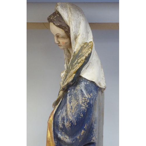 43 - A 19thC carved and painted wooden figure 'St Lucy Patron Saint of Sight and Sufferers of Eye Disease... 