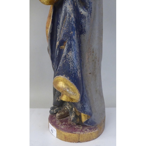 43 - A 19thC carved and painted wooden figure 'St Lucy Patron Saint of Sight and Sufferers of Eye Disease... 