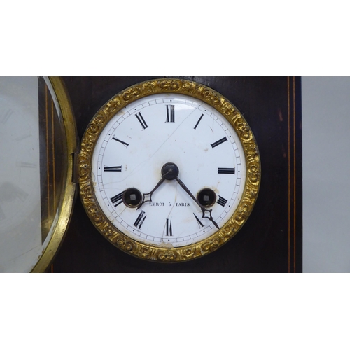 47 - A late 19thC French part ebonised and string inlaid mantel clock of box design; the bell strike move... 