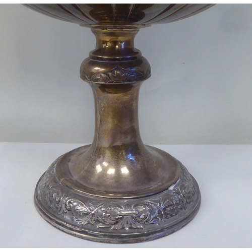 53 - A late 19thC silver Bulawayo Rifle Club trophy cup of pedestal form with twin handles, cast and chas... 