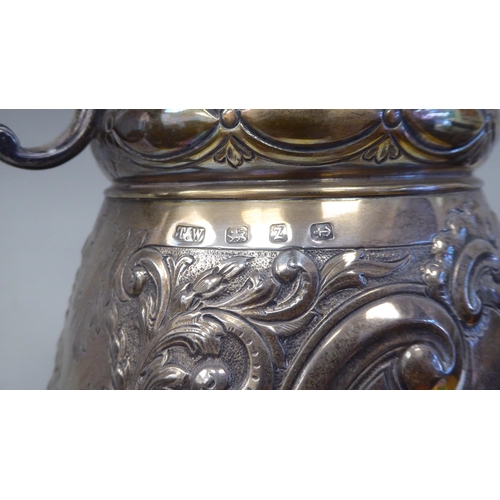 53 - A late 19thC silver Bulawayo Rifle Club trophy cup of pedestal form with twin handles, cast and chas... 