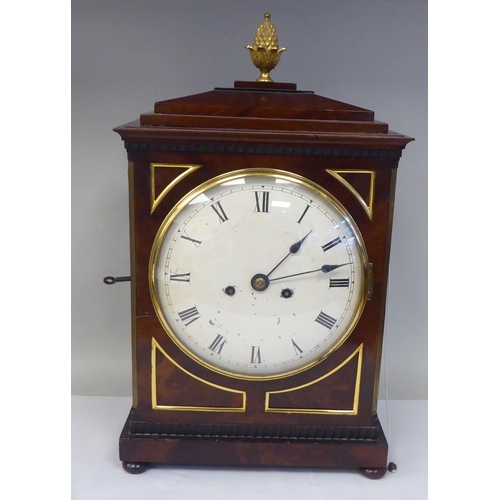 60 - A George III mahogany cased bracket clock with a stepped top, gilt metal pineapple finial and brass ... 