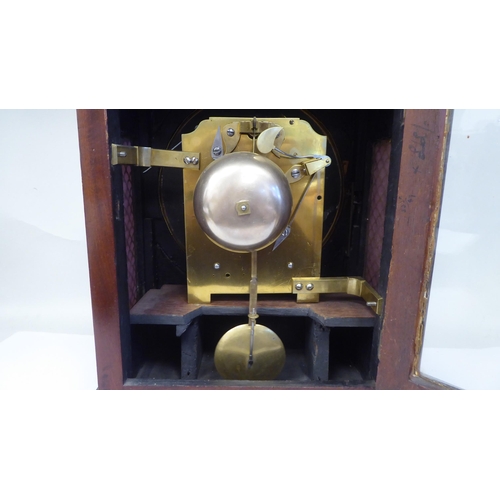 60 - A George III mahogany cased bracket clock with a stepped top, gilt metal pineapple finial and brass ... 