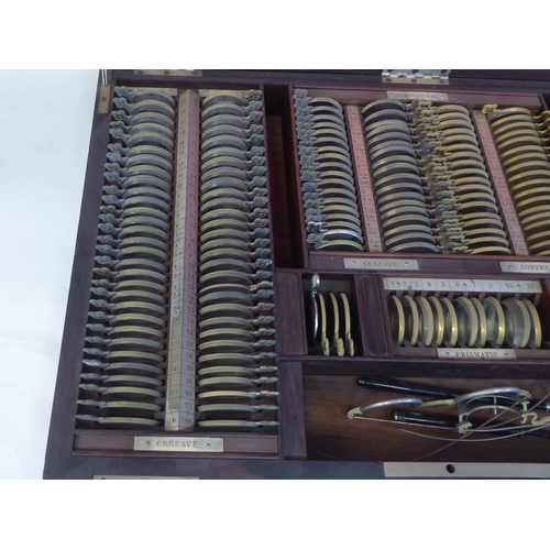 67 - A set of circa 1900 optician's refracting lenses for spectacle testing, in a fitted rosewood case  3... 