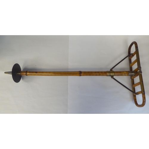 7 - An Edwardian bamboo shooting stick with brass and steel mounts