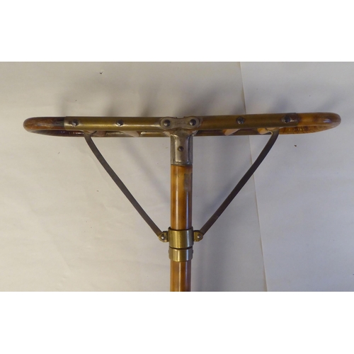 7 - An Edwardian bamboo shooting stick with brass and steel mounts