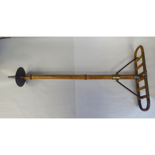 7 - An Edwardian bamboo shooting stick with brass and steel mounts