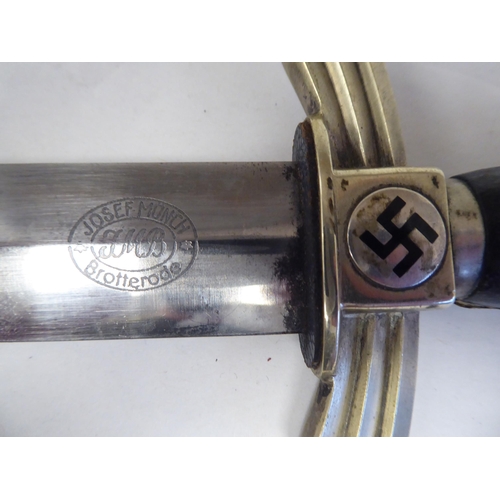 75 - A Third Reich period DLV Flyer's dress knife with nickel plated fittings, an enamelled swastika on t... 