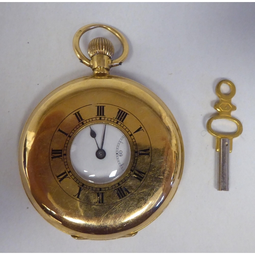 8 - An 18ct gold cased half-hunter pocket watch, the movement faced by a white enamel Roman dial, incorp... 