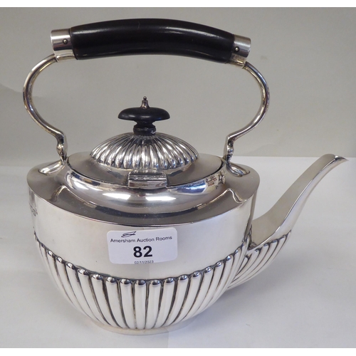 82 - A late Victorian four piece silver tea set of oval, demi-reeded form  comprising a teapot and pedest... 