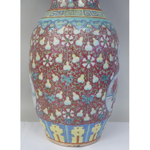 91 - A late 19th/early 20thC Chinese porcelain baluster shape vase with a narrow neck and flared rim, dec... 