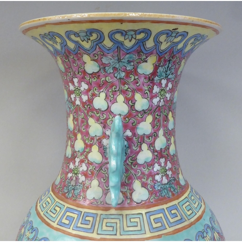 91 - A late 19th/early 20thC Chinese porcelain baluster shape vase with a narrow neck and flared rim, dec... 