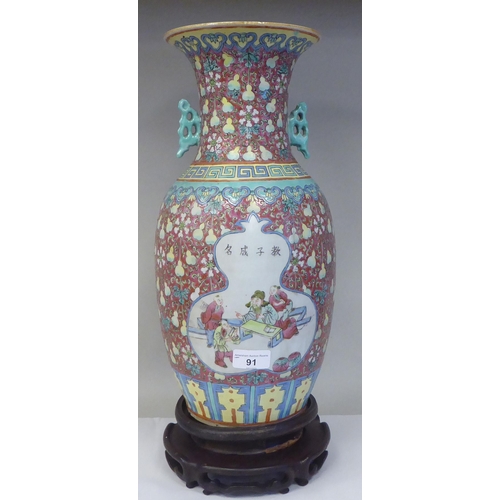 91 - A late 19th/early 20thC Chinese porcelain baluster shape vase with a narrow neck and flared rim, dec... 