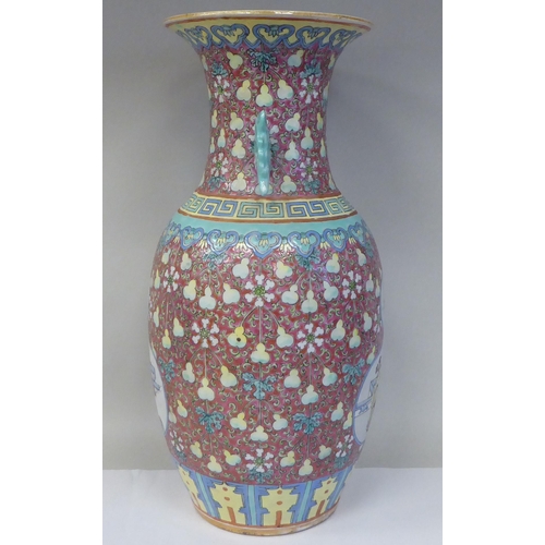 91 - A late 19th/early 20thC Chinese porcelain baluster shape vase with a narrow neck and flared rim, dec... 