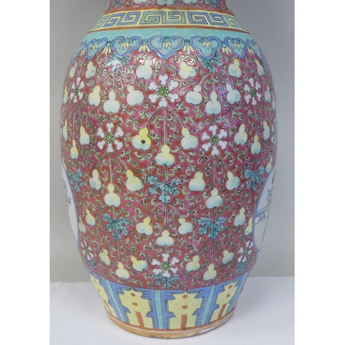 91 - A late 19th/early 20thC Chinese porcelain baluster shape vase with a narrow neck and flared rim, dec... 