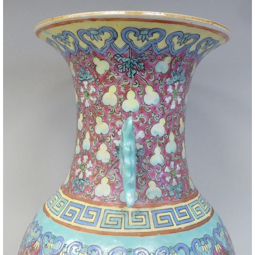 91 - A late 19th/early 20thC Chinese porcelain baluster shape vase with a narrow neck and flared rim, dec... 