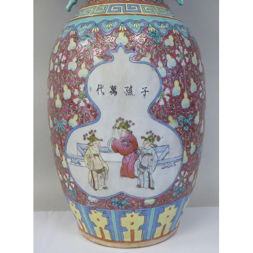 91 - A late 19th/early 20thC Chinese porcelain baluster shape vase with a narrow neck and flared rim, dec... 