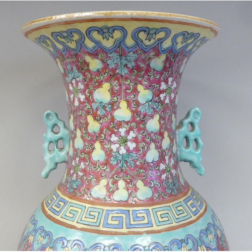 91 - A late 19th/early 20thC Chinese porcelain baluster shape vase with a narrow neck and flared rim, dec... 