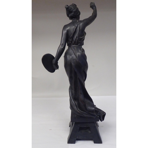 94 - After E Villanis - a cast and patinated standing figure, a classically inspired female artist, on a ... 