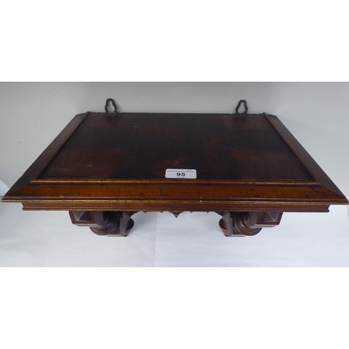 95 - A late Victorian walnut clock bracket, the platform top over a series of elaborately turned supports... 