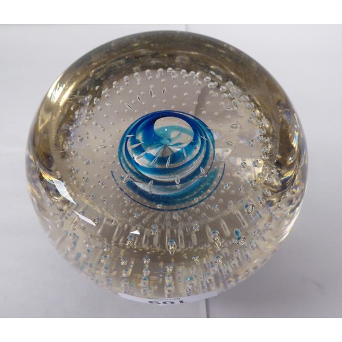 109 - A vintage Whitefriars glass doorstop of domed, clear, bubbled form, decorated on the interior with a... 