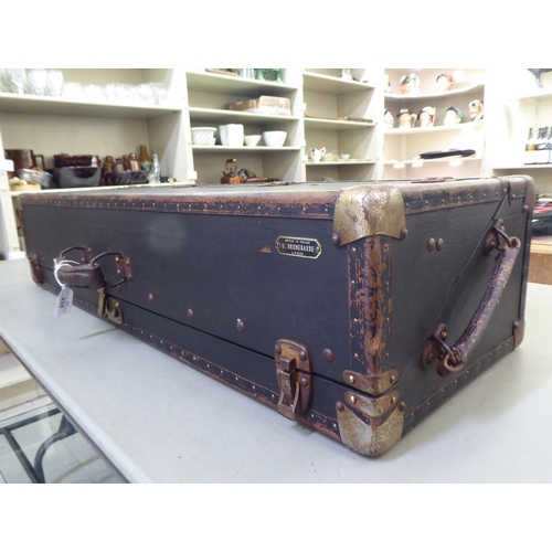 234 - A black faux hide covered salesman's trunk with metal bracket supports  37