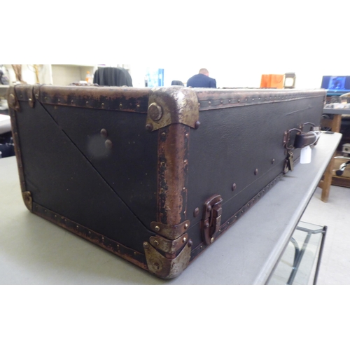 234 - A black faux hide covered salesman's trunk with metal bracket supports  37