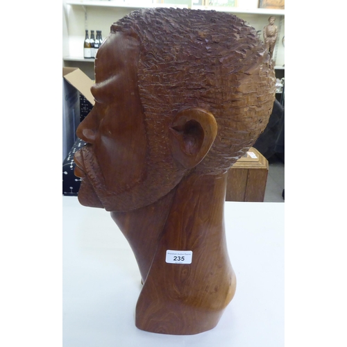 235 - An African carved fruitwood bust of a man  19