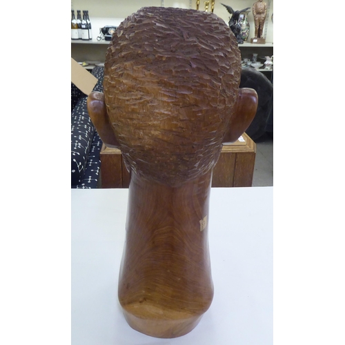 235 - An African carved fruitwood bust of a man  19