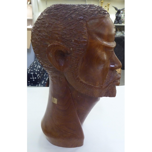 235 - An African carved fruitwood bust of a man  19