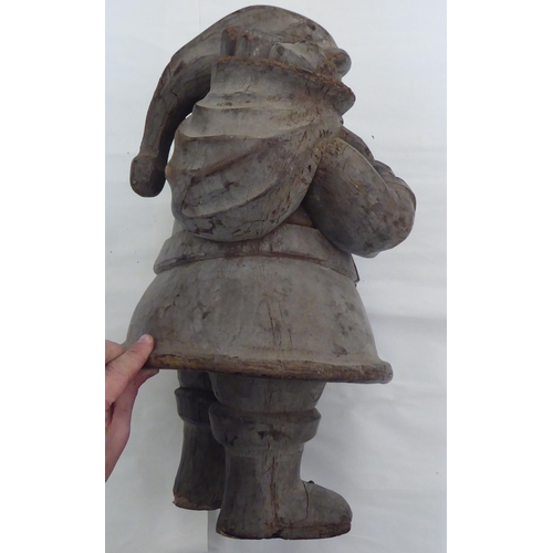 236 - A carved fruitwood figure 'Father Christmas'  20