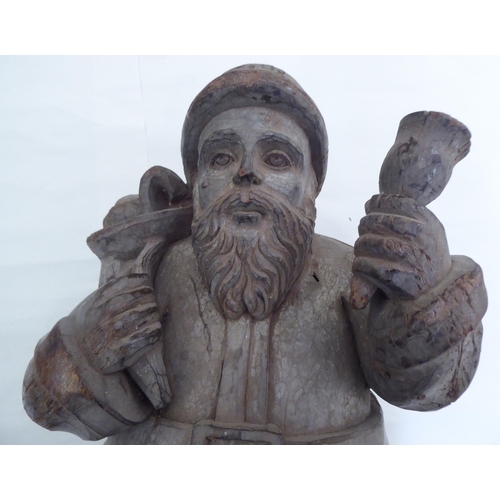 236 - A carved fruitwood figure 'Father Christmas'  20