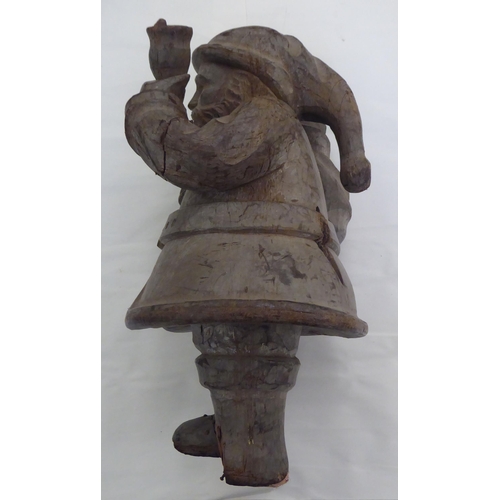 236 - A carved fruitwood figure 'Father Christmas'  20