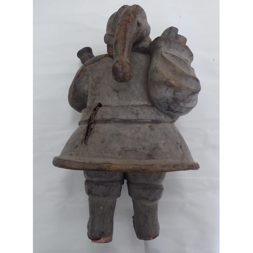 236 - A carved fruitwood figure 'Father Christmas'  20