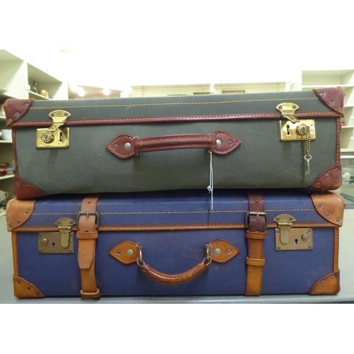 241 - Two similar canvas bound and leather clad suitcases  9