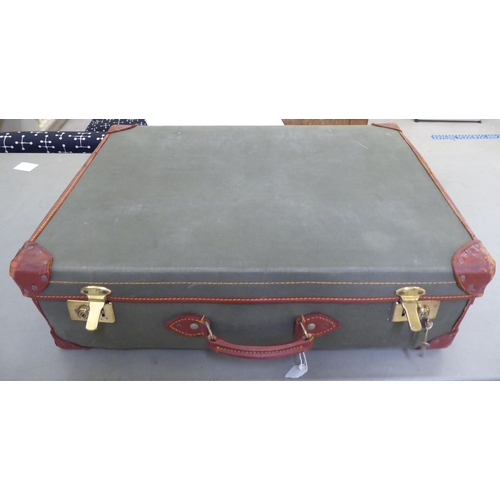 241 - Two similar canvas bound and leather clad suitcases  9