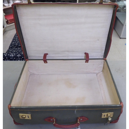 241 - Two similar canvas bound and leather clad suitcases  9