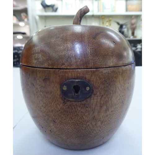 242 - An early 19thC fruitwood tea caddy, fashioned as an apple with a hinged lid  5.5