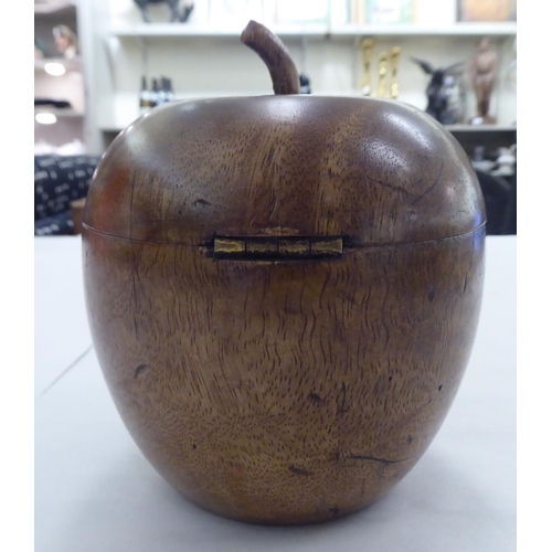 242 - An early 19thC fruitwood tea caddy, fashioned as an apple with a hinged lid  5.5