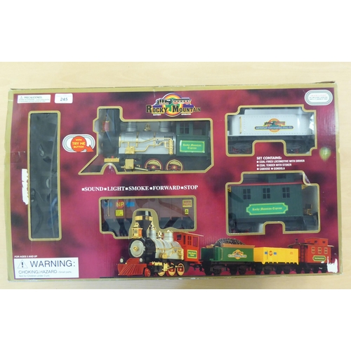 245 - A Rocky Mountain battery operated train set, comprising a locomotive and tender, two carriages and t... 