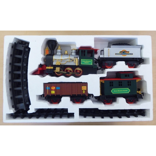 245 - A Rocky Mountain battery operated train set, comprising a locomotive and tender, two carriages and t... 