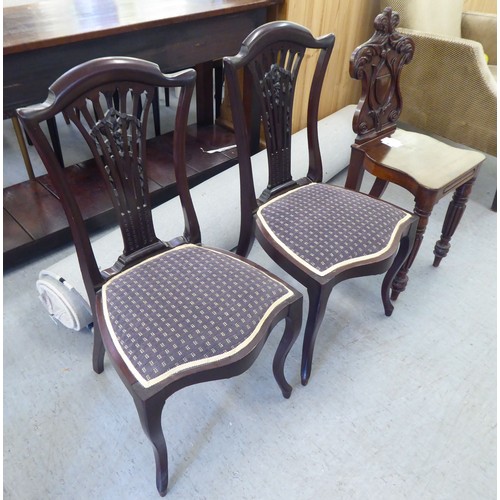 223 - Two Edwardian mahogany framed salon chairs with splat backs, raised on cabriole legs; and a mid Vict... 