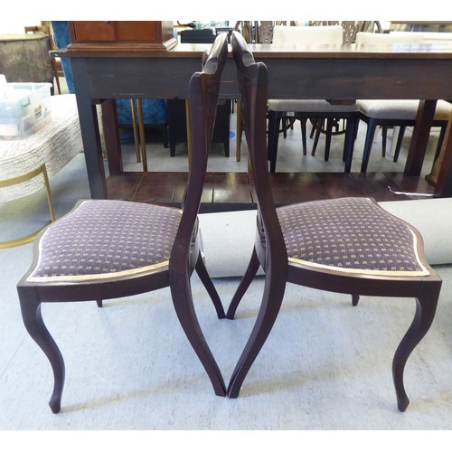 223 - Two Edwardian mahogany framed salon chairs with splat backs, raised on cabriole legs; and a mid Vict... 