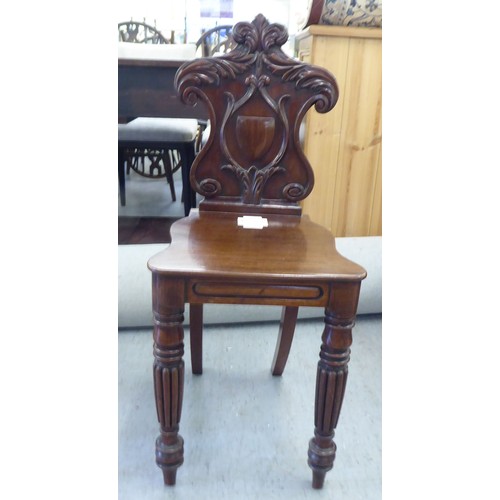 223 - Two Edwardian mahogany framed salon chairs with splat backs, raised on cabriole legs; and a mid Vict... 