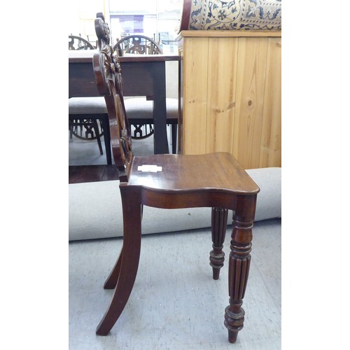 223 - Two Edwardian mahogany framed salon chairs with splat backs, raised on cabriole legs; and a mid Vict... 