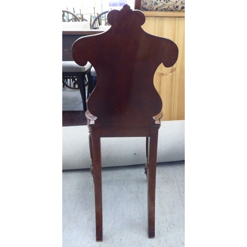 223 - Two Edwardian mahogany framed salon chairs with splat backs, raised on cabriole legs; and a mid Vict... 