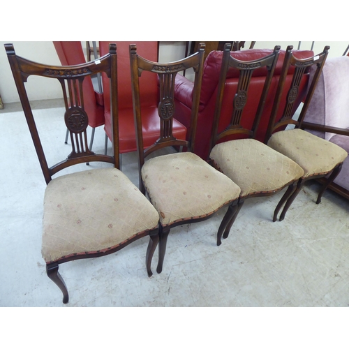 228 - A set of four Edwardian mahogany framed salon chairs, each with a splat back and upholstered seat, r... 